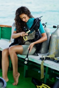 beautiful woman checking diving. dive equipment